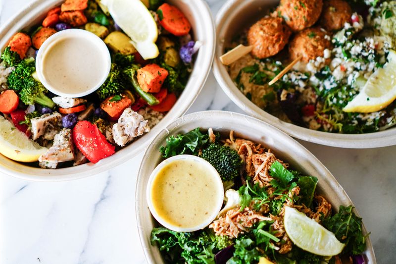 Quinoa grain bowl with roasted vegetables and tahini dressing